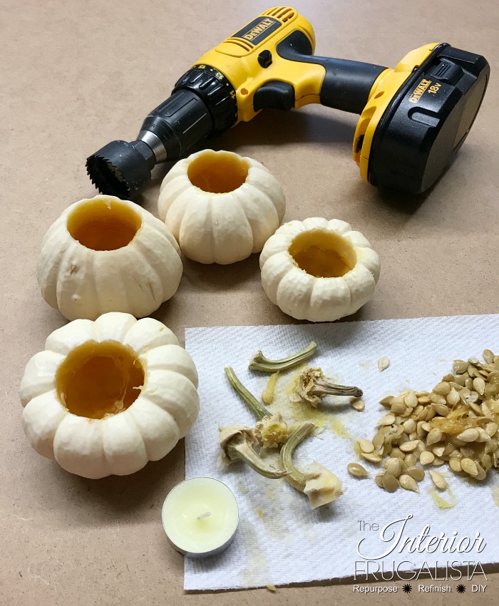 How to turn real mini pumpkins into tealight candle holders for fall plus tips for how to preserve the pumpkin stems to use for future fall crafts.