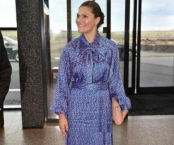 Crown Princess Victoria wore StarStudio PR Baroque pearl earrings, a new printed dress by Rodebjer. HM Dark blue dress