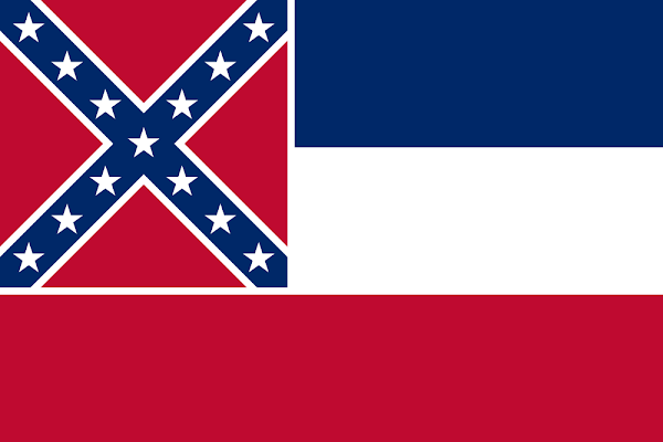 Former flag of the US state of Mississippi, retired in June 2020, controversial for containing the battle emblem of the pro-slavery Confederate States of America, a 19th Century separatist rebellion.