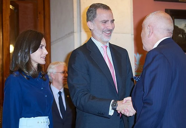 Queen Letizia wore Hugo Boss high waisted pencil skirt same worn Crown Princess Mary,, and Carolina Herrera navy shirt, and Magrit pumps