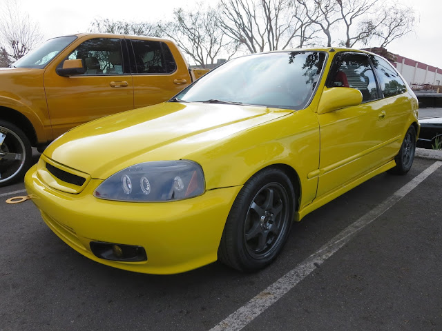 The Screaming Yellow Buzz Bomb Honda Civic Hatchback at Almost Everything Auto Body
