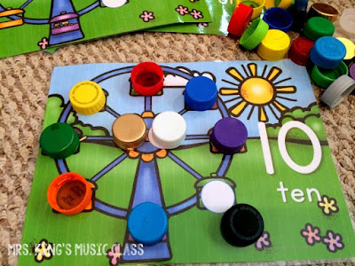 Princesses Don’t Do Math – Number Mat Ideas for a Reluctant Learner.  You’ll love these number mat ideas for getting your reluctant preschooler playing, counting and adding their way to success.  Number mats are great for developing number sense and these mats work with bottle caps!  They can work with playdough, rocks, and more but I think you’ll like how perfectly the bottle caps can work with any theme.  Great for preschool and kindergarten aged students in workstations or at home.