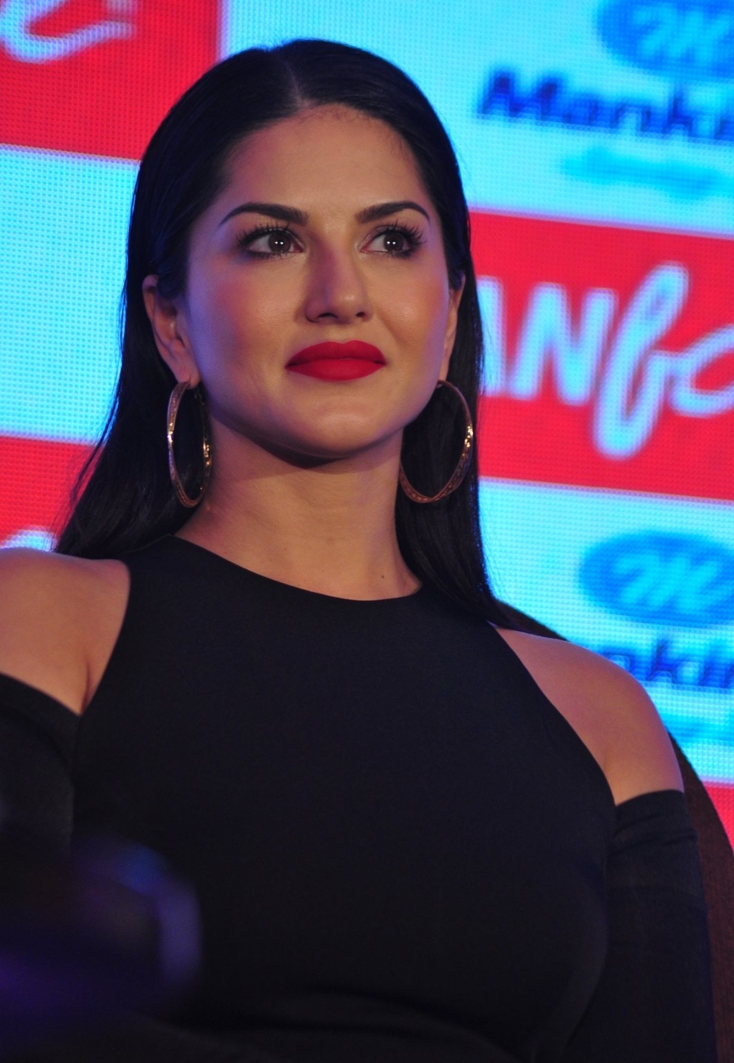Sunny Leone Showcasing Her Sexy Curves in a Black Figure Hugging Dress At The Manforce Calendar Launch Event in Mumbai