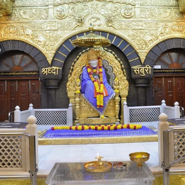 Blue Color Clothes wear Sai baba in this images 