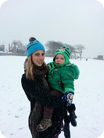 Mother and son in the snow, toddler in snow