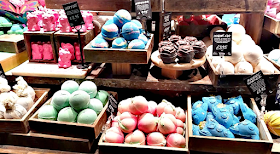 The shelves filled with Lush bath bombs
