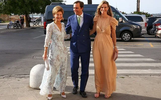 Princess Marie Astrid wore the Kinsky Honeysuckle tiara from the collection of the Princely Family of Liechtenstein. Wedding dress