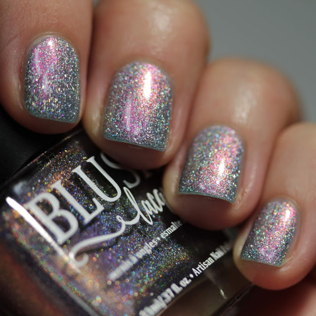 Blue holographic nail polish with pink shimmer