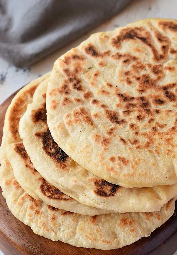 a close up of bowl with best pita bread