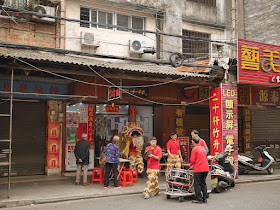 Lion dance troupe at a noodle restaurant in Jiangmen