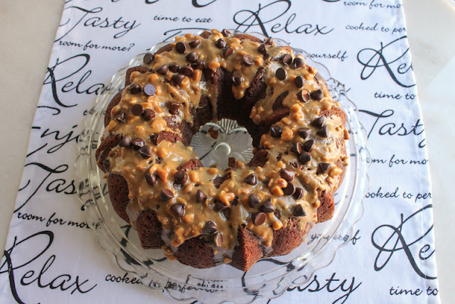 Food Lust People Love: It looks like cake and tastes like cake but this is actually a big peanut butter chocolate chip muffin baked in a Bundt pan! Made with the muffin method of mixing wet and dry ingredients in one bowl, it’s fast, easy and delicious. Because this is a celebratory muffin Bundt, I topped it with some melted crunchy peanut butter (and butter) and a generous sprinkling of semi-sweet chocolate chips. You can leave those off but I think you’ll be sorry you did!