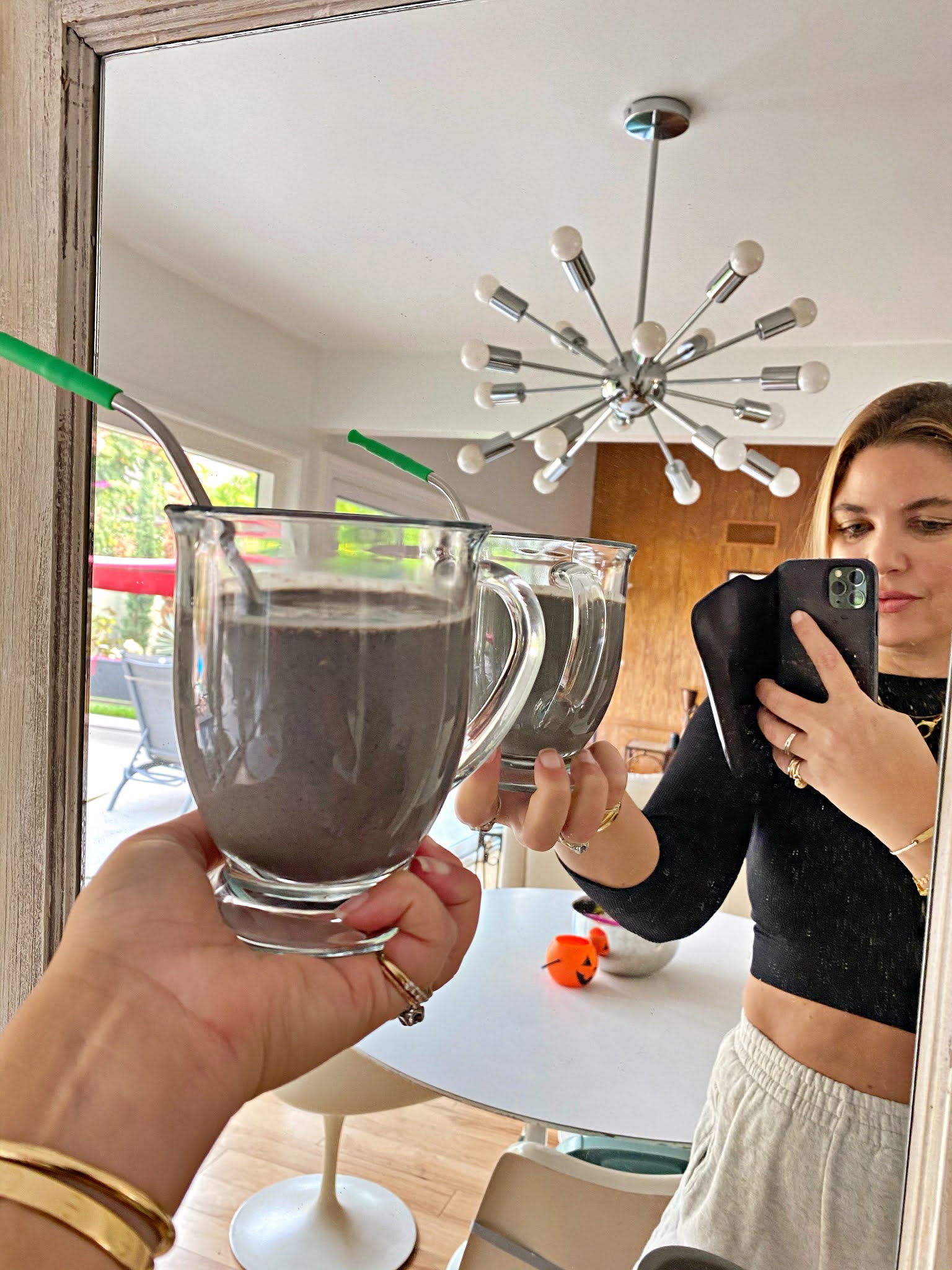 woman holding a smoothie for november newness