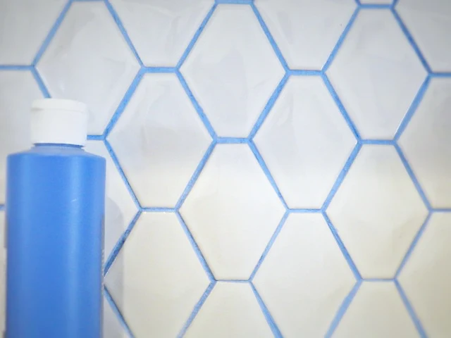 blue acrylic paint in grout