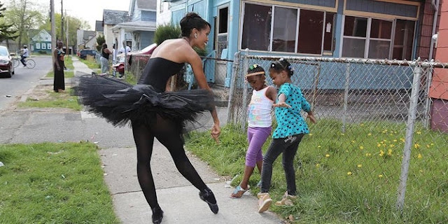Ballet dancer in rough neighborhood