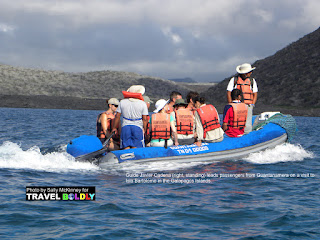Travel Boldly Galapagos Island - Guide Javier Cadena (right, standing) leads passengers from Guantanamera on a visit to Isla Bartolome.
