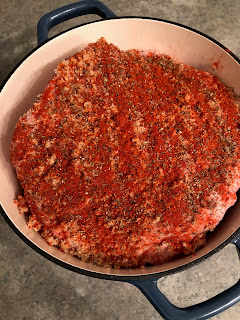 whole pork shoulder with seasoning on top