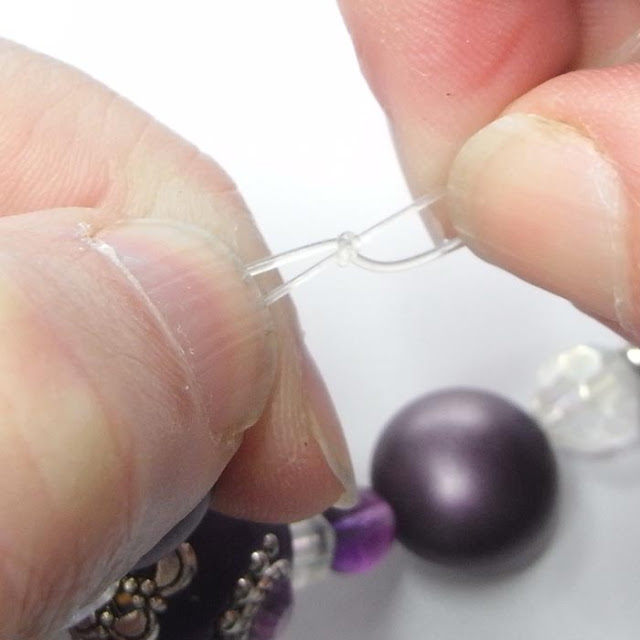 Tightening the knot in beading elastic