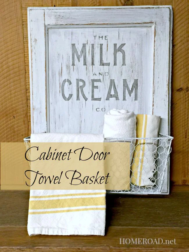 Distressed cabinet door basket with tea towels