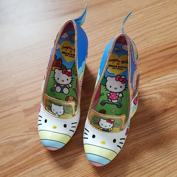 Hello Kitty shoes with colourful Sanrio insoles on floor