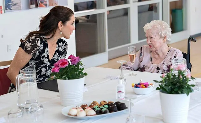 Crown Princess Mary wore a new floral wrap dress from Ralph Lauren, and Gianvito Rossi pumps, Dulong Esme bracelet, Cartier Love Bracelet