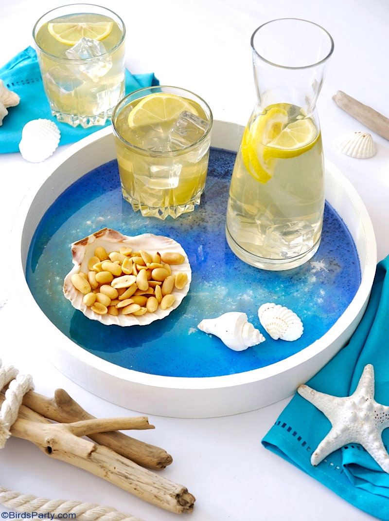 DIY Beach Inspired Epoxy Resin Tray - easy craft idea to serve drinks or to decorate your home and tables for summer! by BirdsParty.com @birdsparty #diy #crafts #resin #resinart #resincrafts #epoxyresin #resintray #summercarfts #beachcrafts #coastaldecor