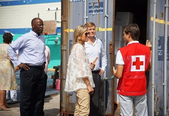 Queen Maxima Jewel wear Mango Floral Earrings, Zara guipure lace top and carried J. Crew Envelope clutch,