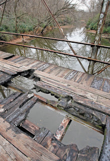 An image of broken sections in Ghost Bridge, Florence, Alabama