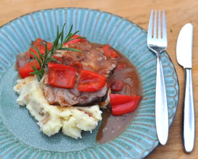 Wine-Braised Pork Roast with Garlic Mashed Potatoes ♥ KitchenParade.com, how to cook a pork roast in wine and rich spices, with tomatoes and bell peppers.