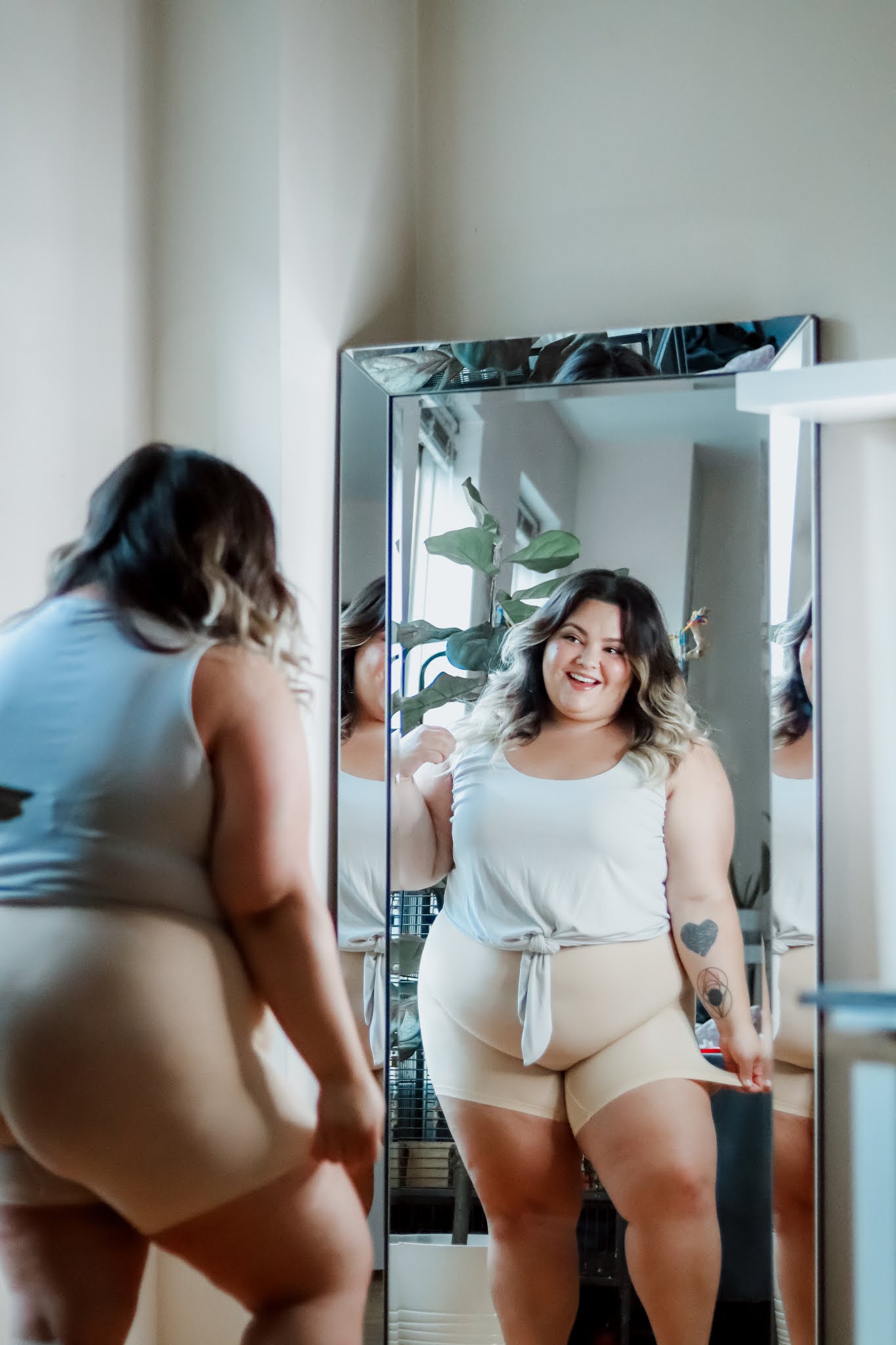 Chicago Plus Size Petite Fashion Blogger Natalie in the City wears Thigh Society's anti chafe shorts.
