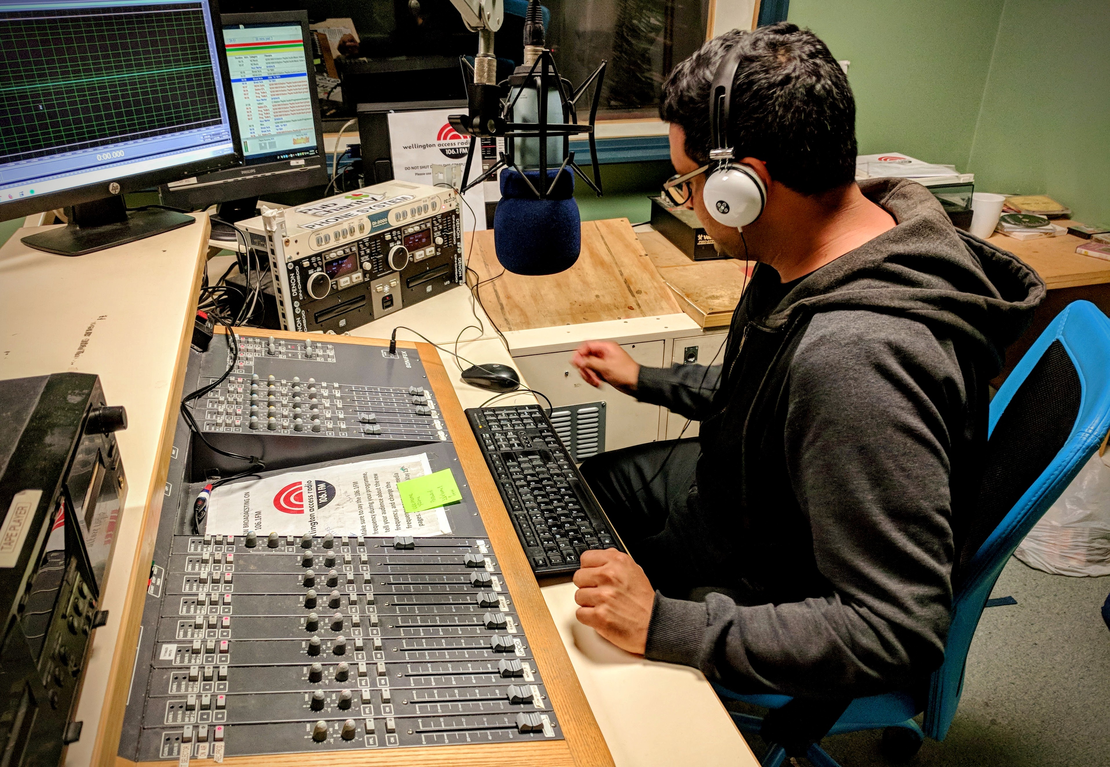 Person operating an audio mixing desk