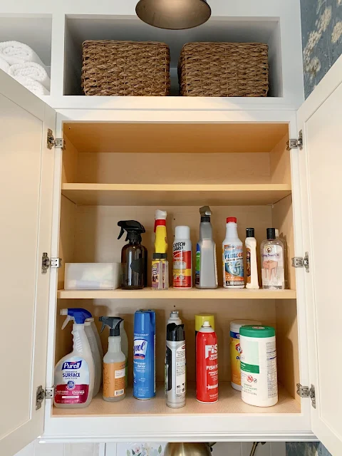 cleaning supply organization in cabinet