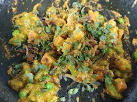 Cooking vegetables with masala for restaurant style veg biryani recipe