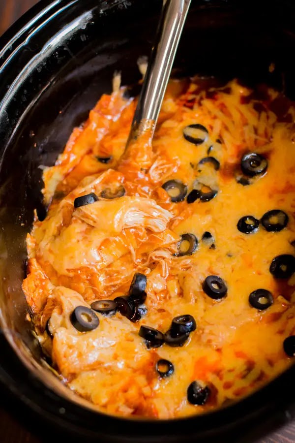 A true on pot meal. The chicken and enchilada sauce is cooked all day in the slow cooker then the casserole fixings are stirred in. A true on pot meal. The chicken and enchilada sauce is cooked all day in the slow cooker then the casserole fixings are stirred in.