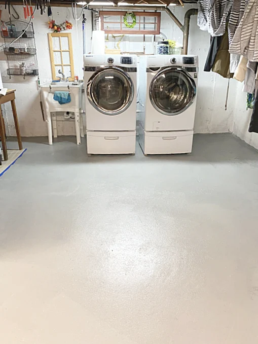 painted basement floor and washer and dryer