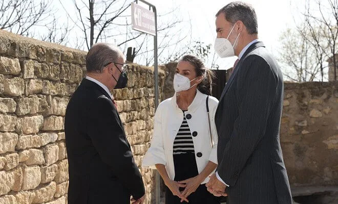 Queen Letizia wore a stripe wool sweater and trousers from Hugo Boss, and new black maysli suede slingback pumps from Manolo Blahnik