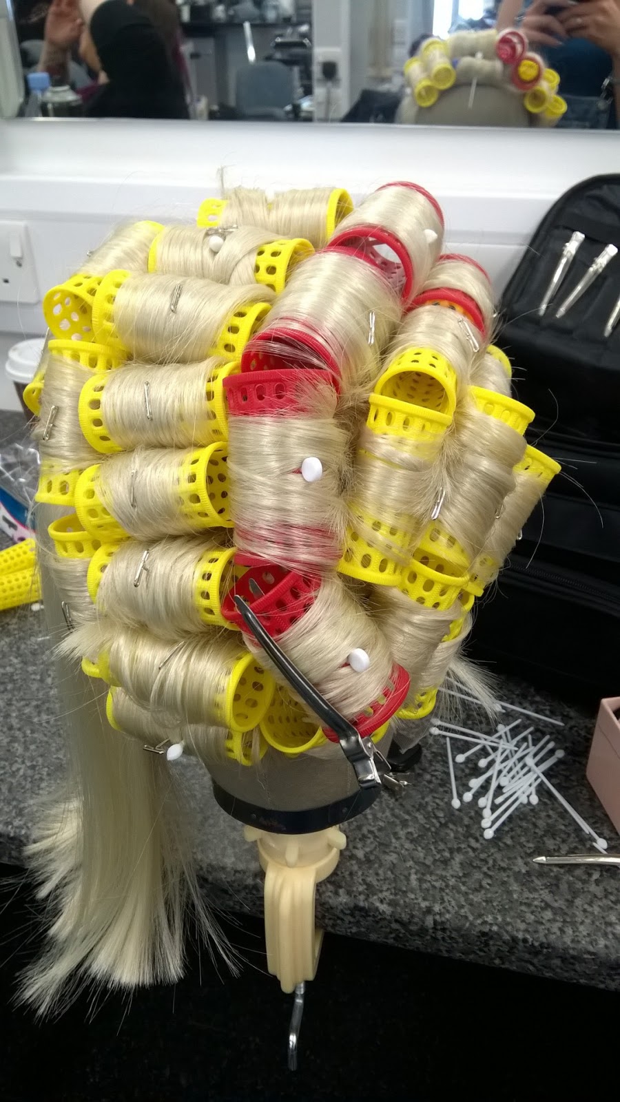 Wig & Postiche How to set an acrylic wig using rollers and steam.