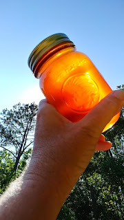 jar of honey in the sun
