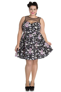 Hell Bunny LIlly Bat  mini dress.  The  Print features Fun and Edgy elements such as bats, skulls, crosses alongside drawings of cute goth kawaii girl. 