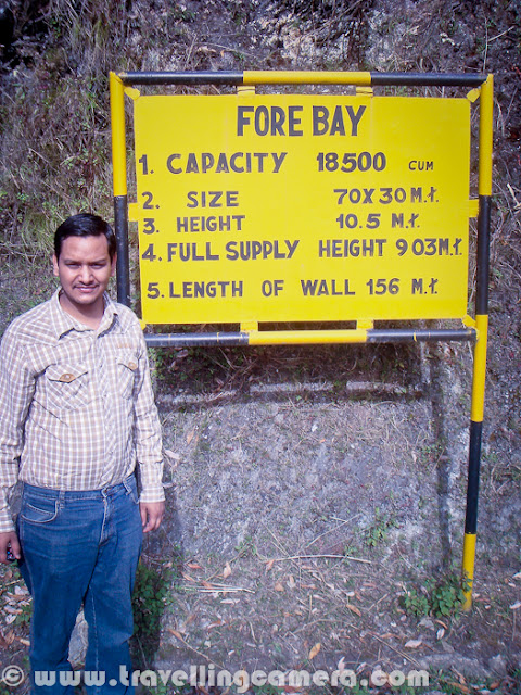 Few years back, I was visiting Palampur for a marriage and had enough time during the day time. So we went to a Hydro project which is located in a small village near Baijnath. Let's start this Photo Journey to Utrala Hydro project in Himachal Pradesh...Here is a photograph of famous Shiva Temple at Baijnath, Himachal Pradesh. We started our journey from Palampur, through Paprola and took a left without touching Baijnath. This cut is just at the boundary of Baijnath town. This Shiva temple is visible on top of hill of Baijnath and visible from surrounding areas. Temple is very well maintained with a committee which is formed to ensure that all necessary things keep happening in the campus without any disturbance or indiscipline. There is a beautiful garden in the back side of this Shiva Temple at Baijnath...Here is a zigzag road which leads to Baijnath. I had heard of lot of Hydro projects in Upper Shimla and Kinnaur regions, but had never though of Palampur region. In Himachal, projects upto 5MW can be setup by private companies and many companies from Himachal and South India are operating in Himachal. To know more, check out http://himurja.nic.in/smallhydro.htmlAfter taking left turn from Paprola, we started climbing up and road was in worst possible state. Very narrow road with no maintenance was taking us towards the place where water was reserved and lots was connected to lot of tunnels on higher hills. The planned town you see in above photograph is probably the colony of workers form this hydro project.We crossed through  various villages and farm-land on the way from Paprola to Utrala. Himachal Pradesh Government decided to explore hydel potential in small hydro sector through private sector participation during 1995-96. Since then allotment of project sites has been a continuous process. Till this year (2011), 450+ Small hydro Electric Projects (upto  5MW  capacity) with an aggregate capacity of 1150+ MW have been allotted to different companies. Out of these 45 projects with an aggregate capacity of 175+ MW have been commissioned. A goal of 500 MW through Small Hydel Projects by the end of 2014 has been fixed...It was a wonderful ride till the project location, if I forget about the part when car tyres were overlapping with road boundaries. It was scary to sit on side seat and look down from your car. At many places, I even suggested to park the car and walk up few kilometers to reach the location.Here is one of the news talking about top companies participating in power generation through hydro projects in Himachal Pradesh - Click.Here is first view we get of small water reservoir on top of the hill. This water comes through various tunnels in surrounding mountains and lifted up after generating some power out of it's heavy pressure on turbines installed down in the base of this huge hill. Puneet standing with information board of Utrala Hydro Project in Himachal Pradesh (In Palampur/Baijnath region.).Hope to visit Kinnaur in 2012 to visit more such projects along with wonderful places around these.