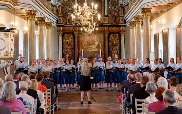 Queen Margrethe wore a floral print silk summer midi dress. Princess Benedikte wore a blue silk midi dress