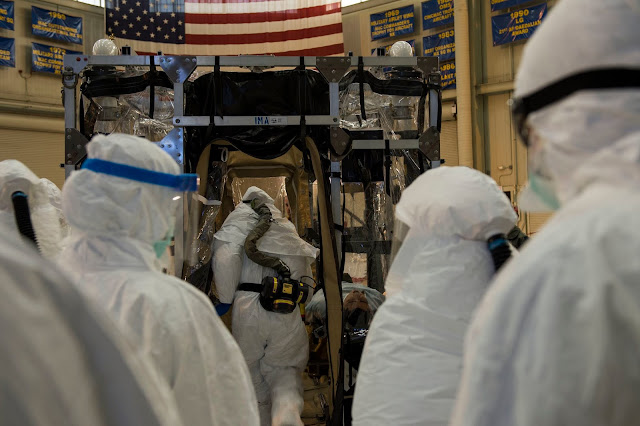 Photo by Airman 1st Class Taylor Queen  1st Combat Camera Squadron Airmen from Joint Base Charleston and the Air Force Operational Test and Evaluation Center build, test and evaluate the Transport Isolation System (TIS) at JB Charleston, Dec. 10, 2014.