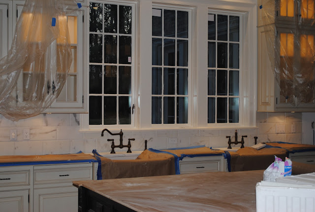During construction of Enchanted Home Tina's kitchen with two farm sinks and trio of windows