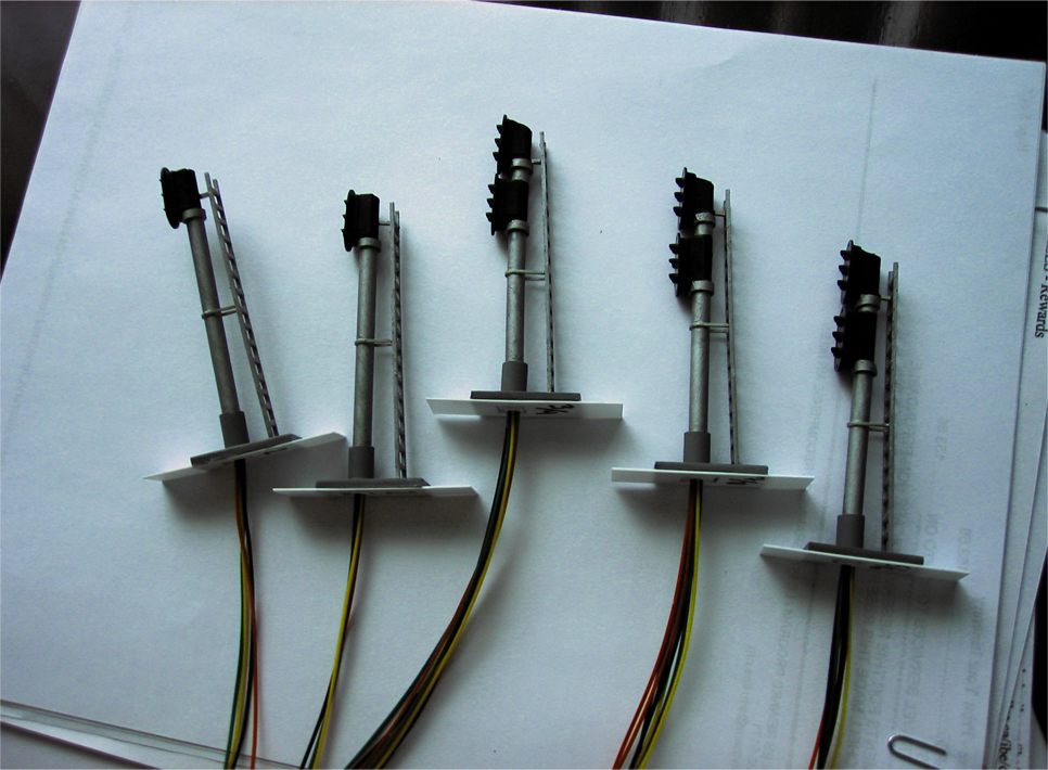 5 finished handmade trackside signals made from styrene tubing