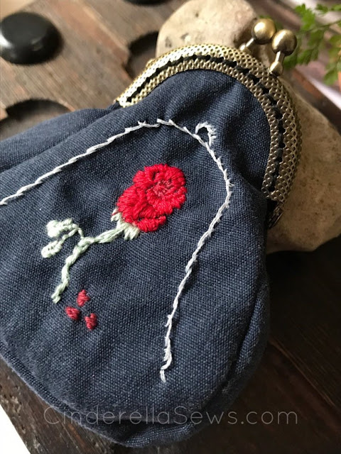 Beauty and the Beast Enchanted Rose Coin Purse is hand embroidered and sewn with a metal clasp for a beautiful fairy tale finish style. The perfect gift for Enchanted Rose and Disney lovers or to spoil yourself with a lovingly made nod to fan art #beautyandthebeast #enchantedrose #embroidery #fanart #coinpurse #handmadegifts