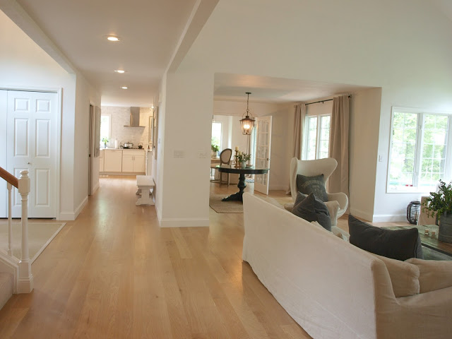 Living room and hallway to kitchen in fixer upper by Hello Lovely 