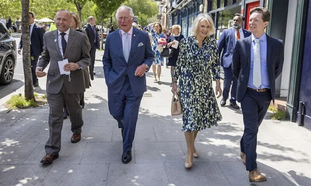 The Duchess of Cornwall wore a floral print silk dress by designer, Fiona Clare. Camilla carried for her Bottega Veneta bag