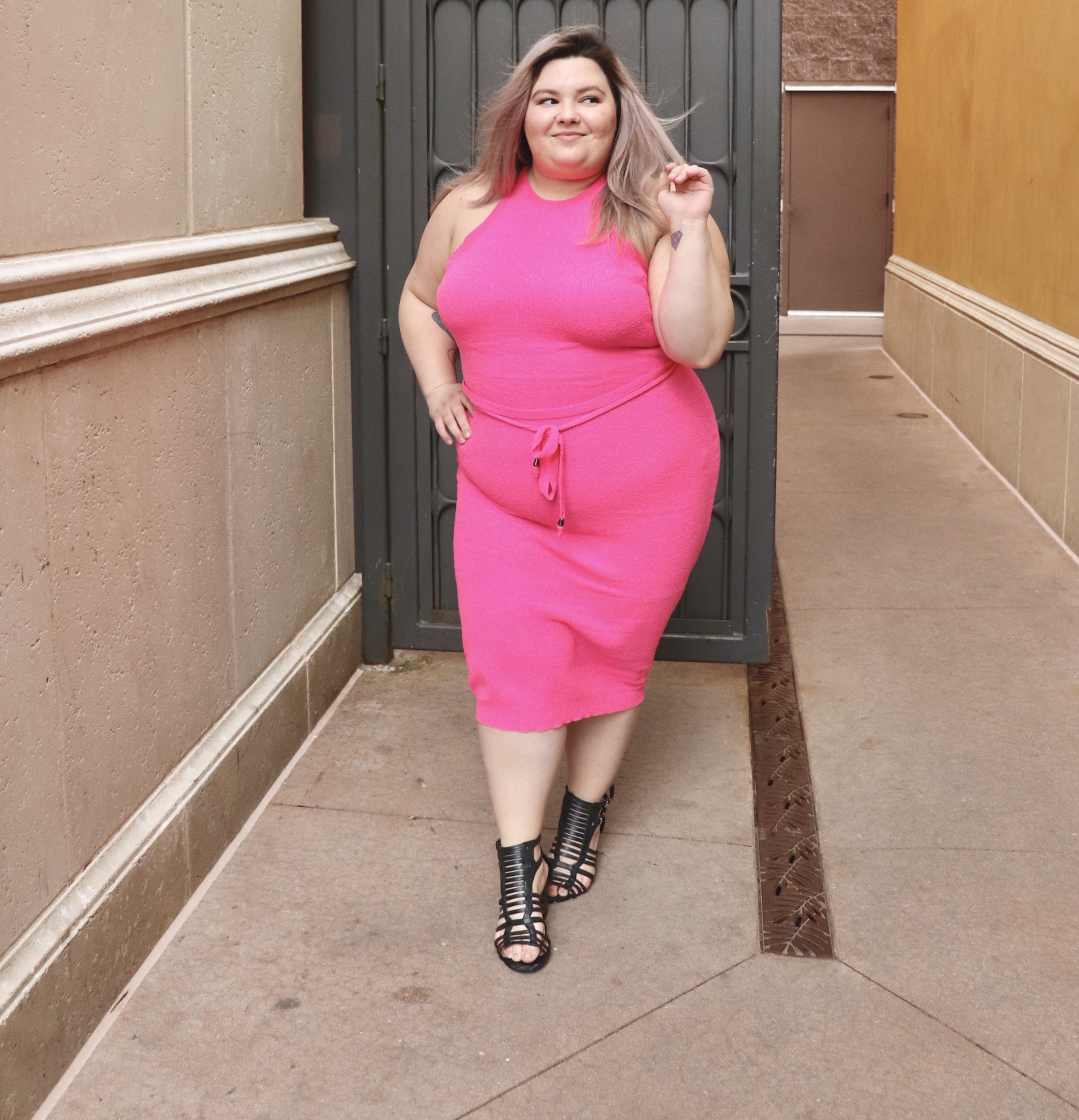 Chicago Plus Size Petite Fashion Blogger, YouTuber, and model Natalie Craig, of Natalie in the City, review's Fashion Nova's neon sweater dresses.