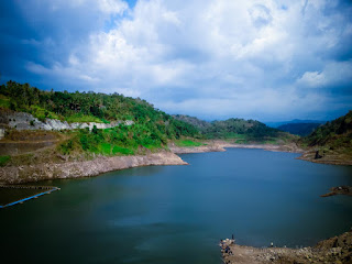 Lake Water Dam Tranquillity Between The Hills In The Sunny Cloudy Day At Titab Ularan Village North Bali Indonesia