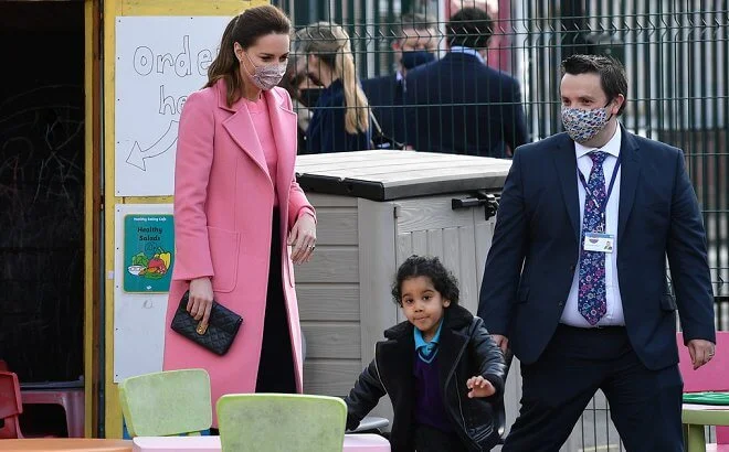 Kate Middleton wore a pink pure wool coat from Max & Co, and a pink scallop jumper from Boden