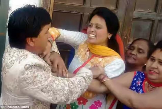 0b Wedding in India descends into farce after groom's first wife storms the venue and beats him up (photos)